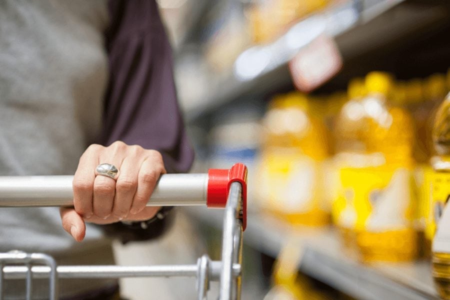 person pushing a shopping trolly