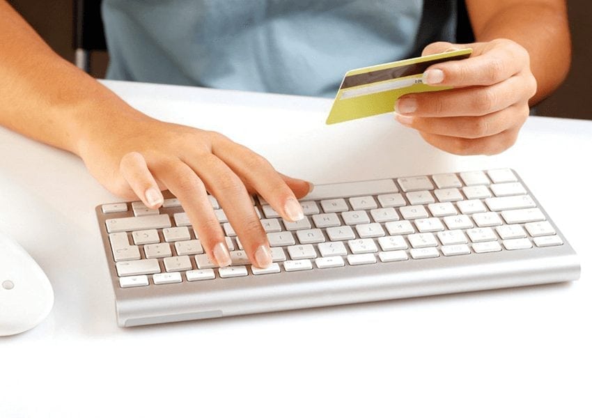 Person using a keyboard to input card details